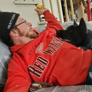 Akita Cuddling with a Men