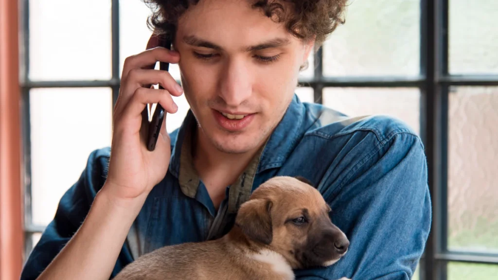 close up man holding cute dog 1