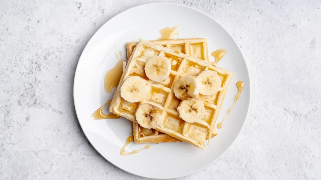 flat lay banana slices honey waffles 1