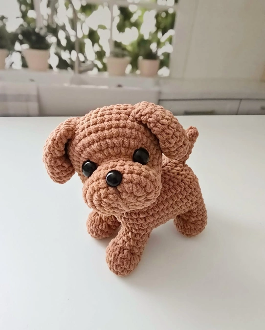 A Plush Brown Crochet Puppy